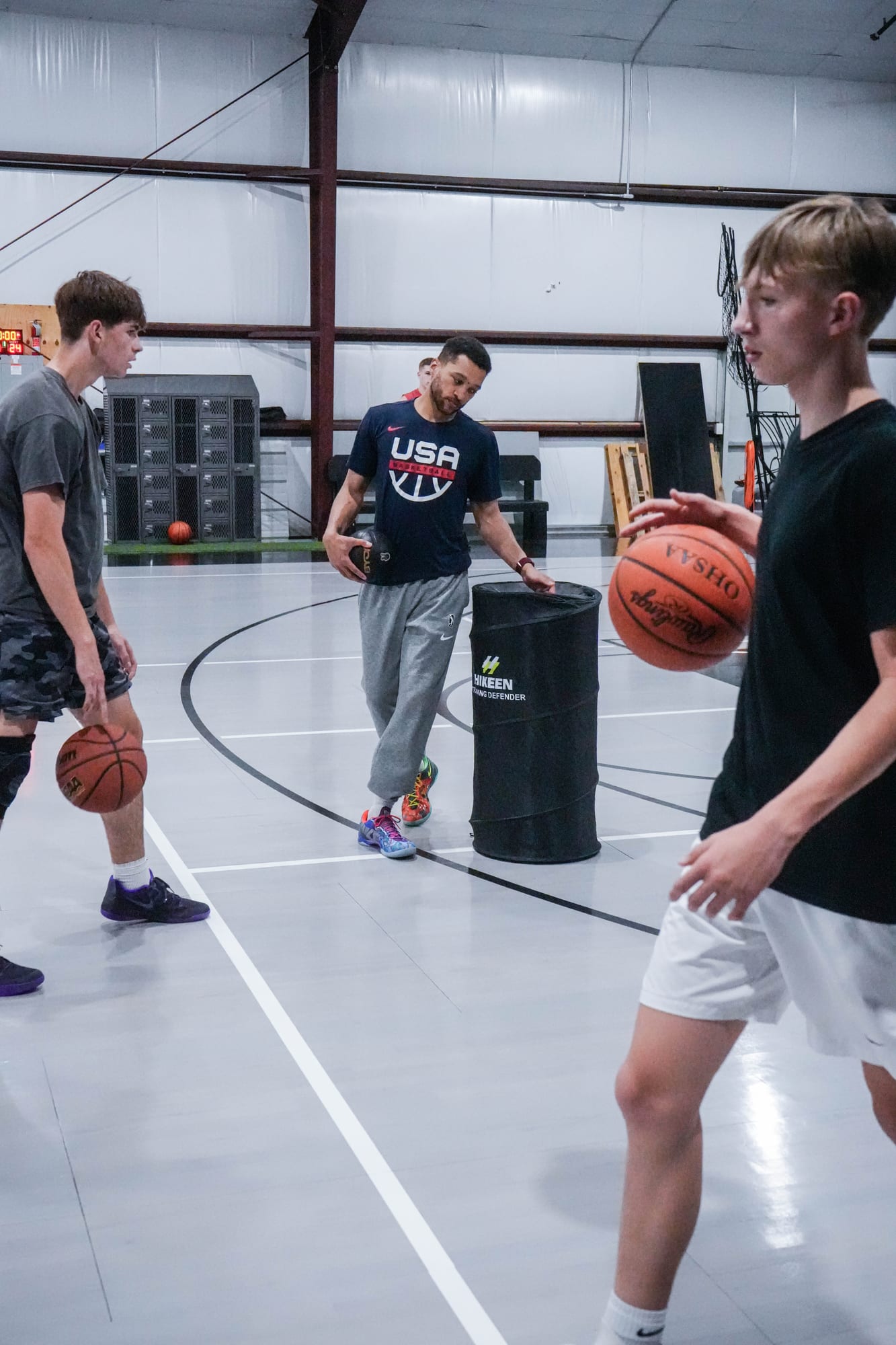 Coach Kyle Randall running a group ball-handling drill at the Game Winner home gym